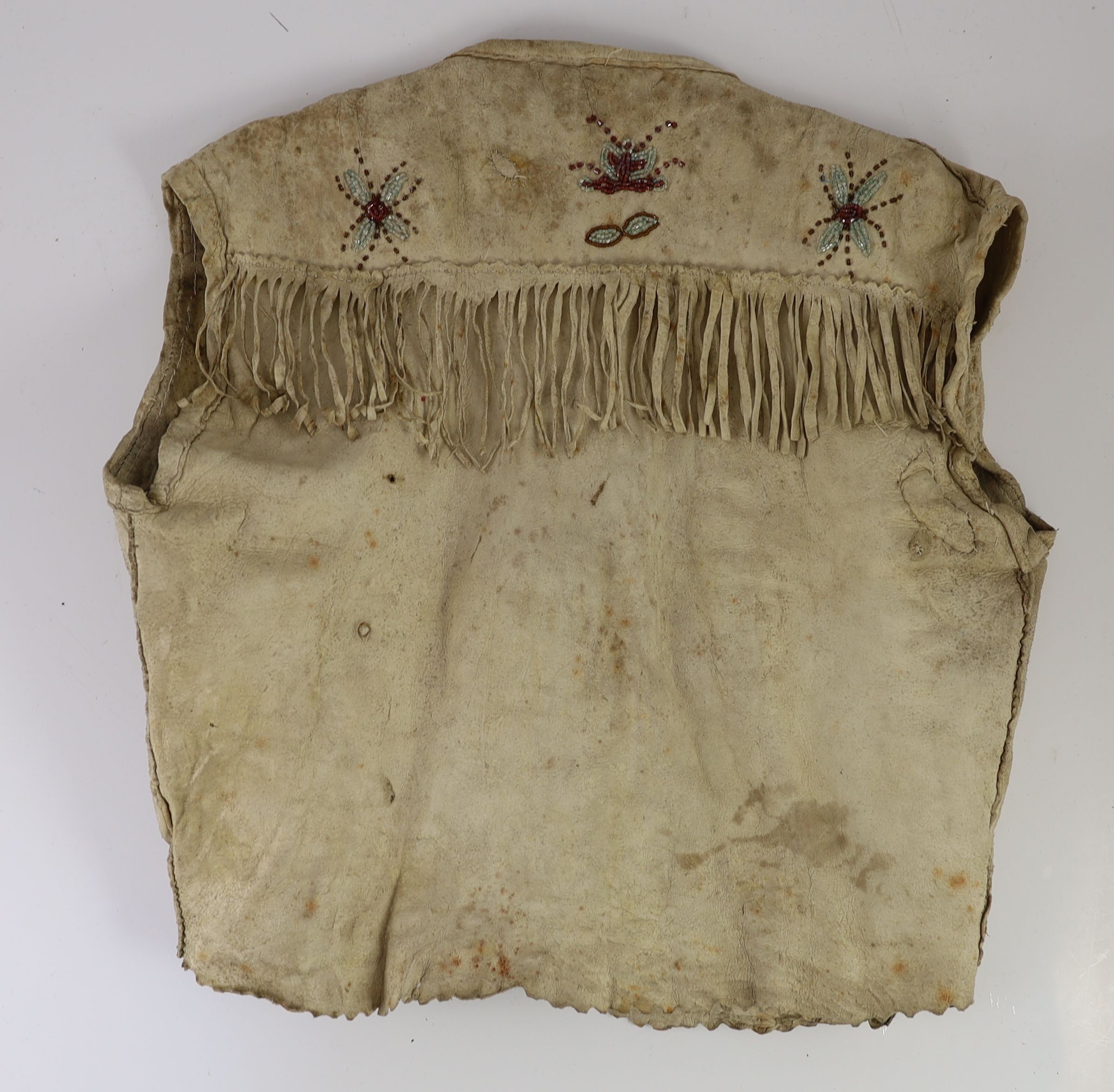A Native American Plains Indian glass beadwork hide waistcoat, probably Iroquois